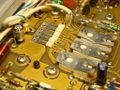 Detail of 50 Ω attenuator. Divider networks (under the ceramic chips) are switched in or bypassed by cam switches. The 0.3 A output fuse can also be seen.