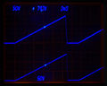 7D12/M2 displaying sawtooth from 585 (lower trace), triggered with delayed gate output from a 7B53A (intensified).